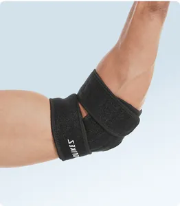 Detailed view of breathable sports elbow brace with adjustable strap on male arm