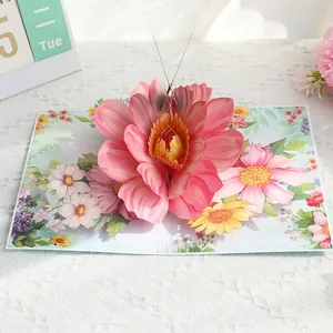Detailed view of 3D pop-up greeting card featuring a large blooming pink paper flower