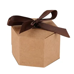 Hexagonal kraft paper gift box with a dark brown ribbon bow for candy packaging.