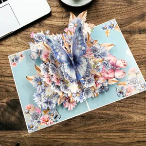 Elegant 3D pop-up greeting card featuring blue butterflies and floral designs on wood