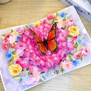 3D pop-up greeting card with vibrant butterfly and floral paper sculpture design