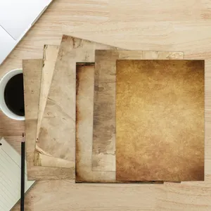 Detailed view of assorted vintage A4 stationery paper with aged textures