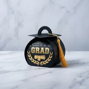 Detailed close-up of a black graduation cap candy box with gold foil and tassel