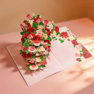 Detailed view of a vibrant 3D pop-up rose bouquet inside a romantic pink greeting card.