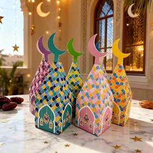 Colorful Ramadan gift boxes with moon toppers and mosaic patterns on a festive marble table.