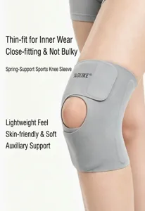 Close-up detail of a breathable grey sports knee brace showing lightweight fabric texture