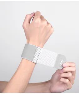 Detailed view of a light grey breathable mesh sports wristband for adjustable support