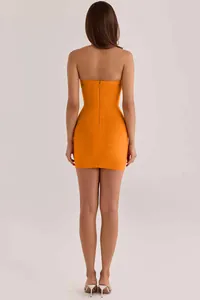 Back view of an elegant orange bodycon bandage mini dress featuring a sleek zipper