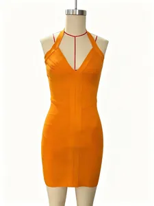 Close-up detail of a vibrant orange sexy deep V-neck bandage bodycon mini dress.