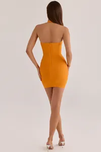Detailed back view of a sexy orange halter bodycon bandage mini dress with zipper