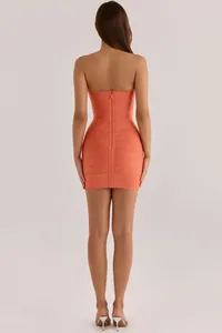Detailed back view of a chic orange strapless bandage bodycon dress with rear zipper detail