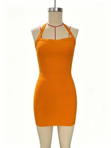 Detailed view of vibrant orange halter neck bodycon bandage mini dress on a mannequin