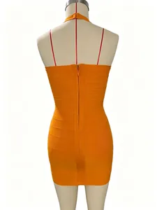 Back view detail of an orange halter neck bandage bodycon mini dress with zipper.