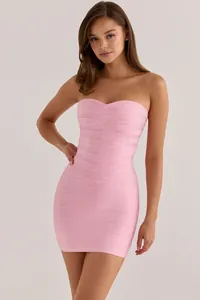 Close-up view of sweetheart neckline on elegant pink strapless bandage bodycon mini dress