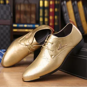 Detail shot of shiny gold crinkle leather men's derby shoes with V metal accent