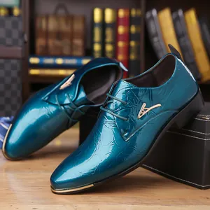 Detailed view of teal cracked texture patent leather Derby shoe with gold hardware