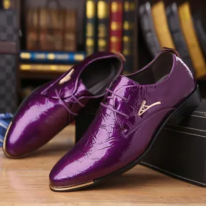 Close-up of purple pointed-toe patent leather Derby shoes with gold accents