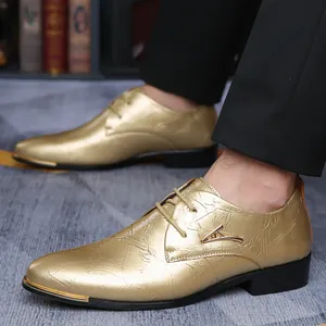 Detail of gold men's pointed-toe lace-up Derby shoes with metallic crinkle texture finish.