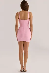 Back view of elegant pink bandage bodycon dress with adjustable straps and zipper detail.