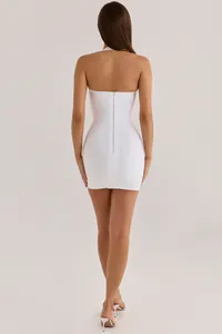 Professional back view of a sexy white bodycon bandage mini dress with halter neck