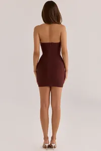 Back view detail showing the zipper of a burgundy strapless bodycon bandage mini dress
