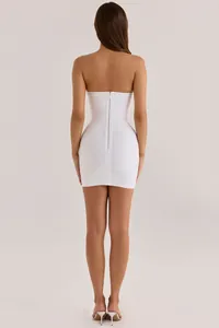Back view of a white strapless bandage bodycon dress showing the zipper and texture.
