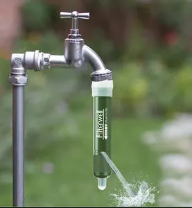 Detail shot of the portable Filterwell straw water filter attached to an outdoor tap