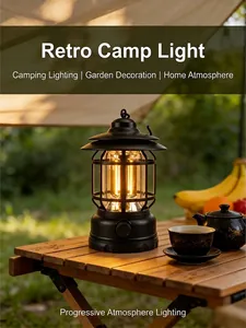 Vintage rechargeable camping lantern on wooden table for outdoor atmosphere