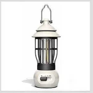 Detail view of retro LED camping lantern in off-white with portable metal handle