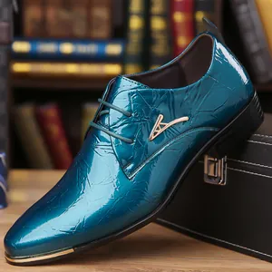 Close-up of teal men's pointed-toe Derby shoe with glossy wrinkled texture and gold buckle.