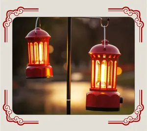 Two red retro camping lanterns hanging on a stand with warm LED light in an outdoor setting