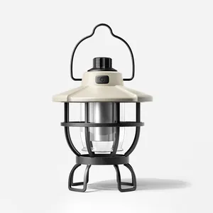 Vintage style LED camping lantern with beige canopy and black wire guard for outdoors