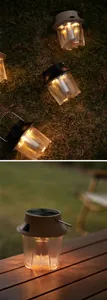 Solar powered outdoor camping lantern with warm LED glow for garden and tent atmosphere