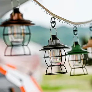 Vintage style LED camping lanterns hanging outdoors for atmospheric tent lighting