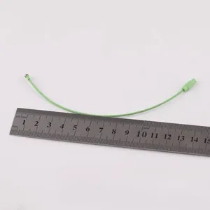 Green colored painted steel wire keychain loop with screw closure measured with a steel ruler