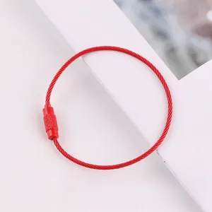 Detailed view of a red lacquer-coated steel wire loop with secure screw connector.