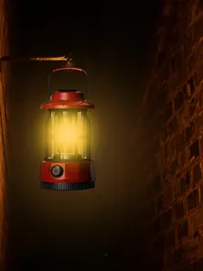 Vintage red LED camping lantern for outdoor retro atmospheric lighting hanging on wall