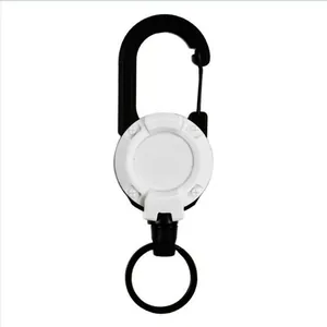 Detail view of a black and white retractable carabiner for outdoor fishing gear.