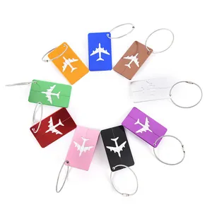 Detailed view of colorful aluminum airplane luggage tags with secure wire loops