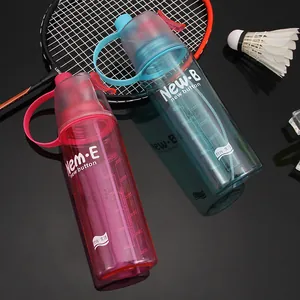 Pair of colorful sports spray water bottles shown with professional badminton props.