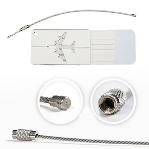 Detail view of aluminum airplane luggage tag with stainless steel wire loop connector