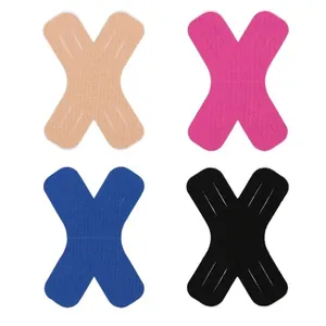 Detailed view of X-shaped kinesiology tape set in four colors for muscle support and protection