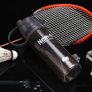 Close-up of a sports spray water bottle with misting nozzle and a racket backdrop