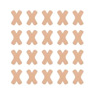 Detail of 20 skin-colored X-shaped kineseology tape patches for sports muscle support