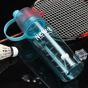 Close-up of cyan plastic sports spray water bottle with 600ml scale and badminton racket.