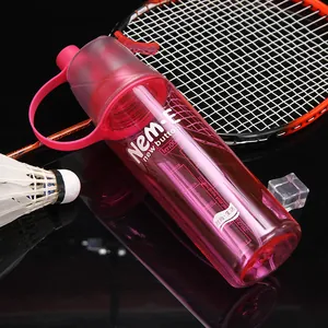 Close-up detail of pink plastic sports spray water bottle with precise capacity scale