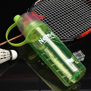 Macro detail of a green translucent sports spray water bottle with 600ml capacity scale