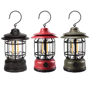 Trois lanternes de camping LED rechargeables de style vintage en noir, rouge et vert