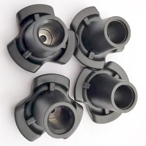 Top-down view of four black non-slip rubber crutch tips showing the stable tri-pod base design