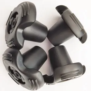 Close-up of four durable black rubber replacement tips for walking canes and crutches.